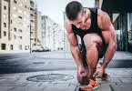 man tying his shoes