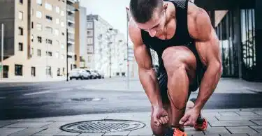 man tying his shoes