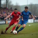 Duel acharné entre deux joueurs lors d'un derby de football amateur en Haute-Loire, stade de campagne avec supporters en arrière-plan
